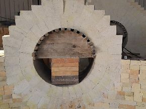 Combination bricks for the combustion port of hot air stove